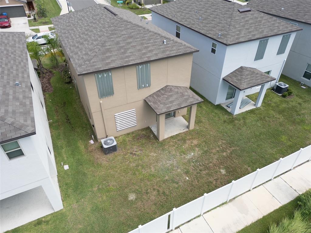 7231 Spring Snowflake Avenue Tampa, FL 33619 - Photo 44 of 46 a aerial view of a house with table and chairs