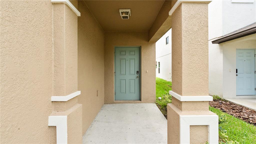 7231 Spring Snowflake Avenue Tampa, FL 33619 - Photo 5 of 46 a bedroom with a bed and a mirror