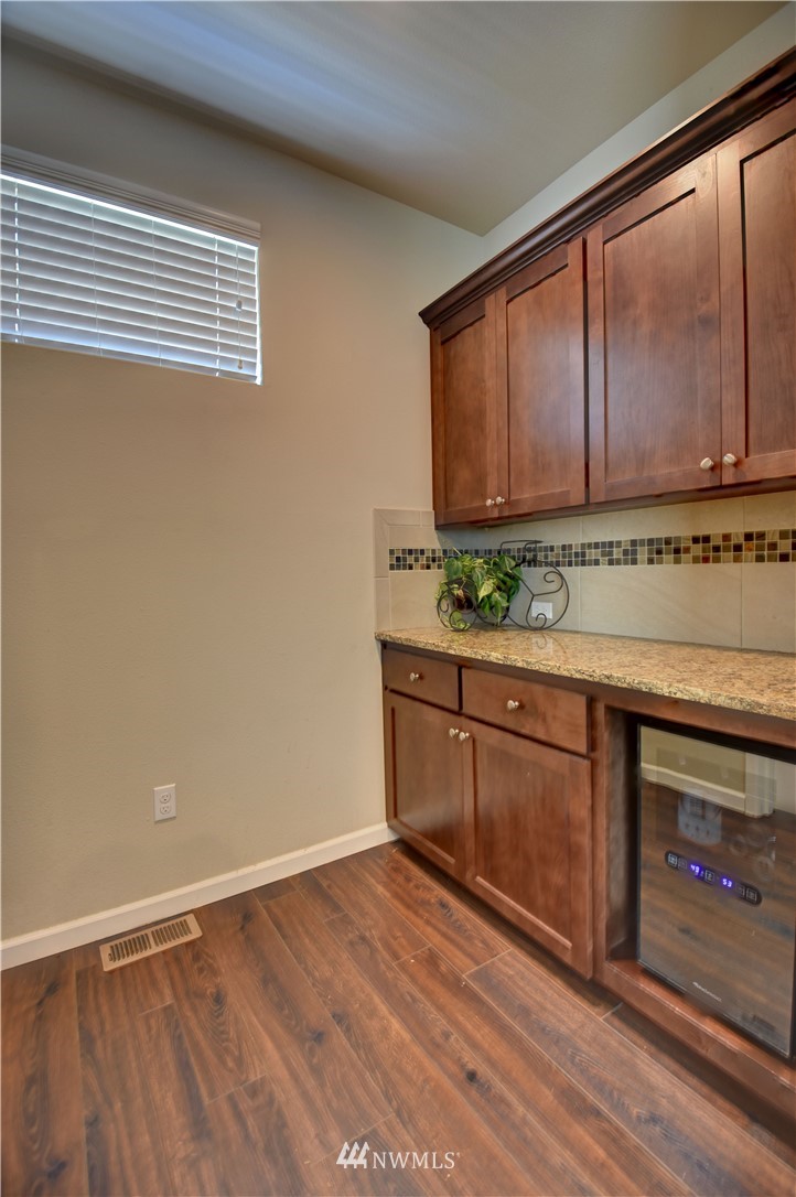 4835 Rosa Court Lacey, WA 98503 - Photo 13 of 40 a kitchen with stainless steel appliances granite countertop a stove a sink and a microwave oven