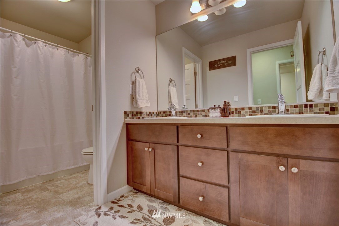 4835 Rosa Court Lacey, WA 98503 - Photo 21 of 40 a bathroom with a sink and a mirror