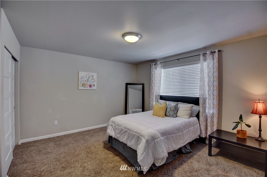 4835 Rosa Court Lacey, WA 98503 - Photo 22 of 40 a bedroom with a bed and a night stand