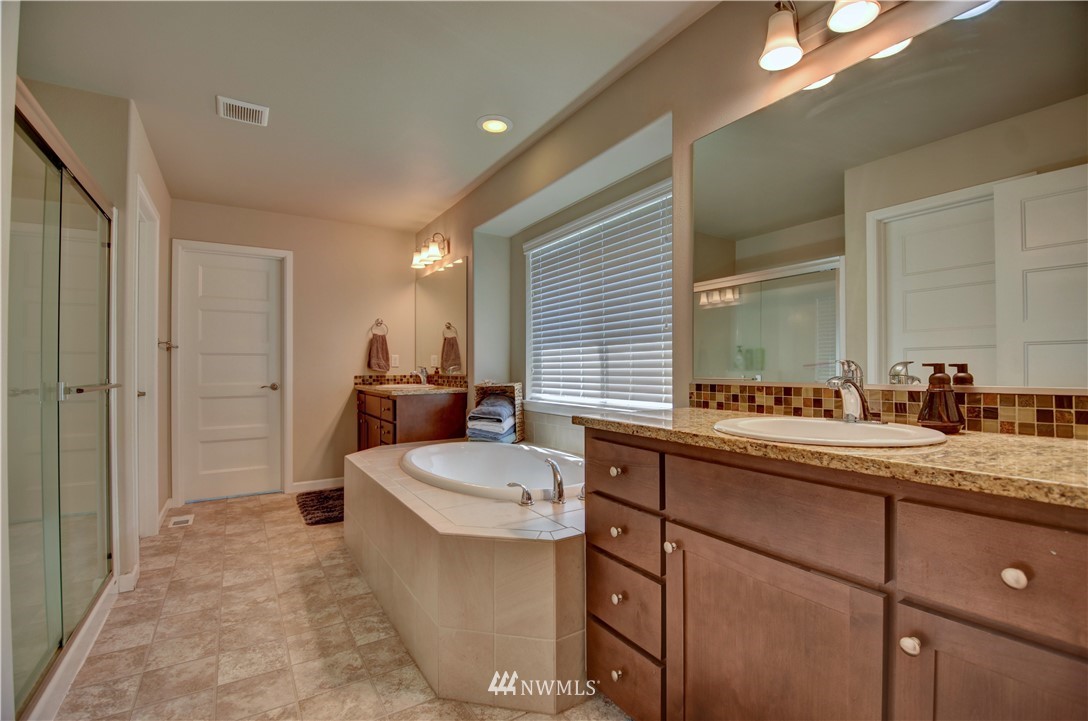 4835 Rosa Court Lacey, WA 98503 - Photo 30 of 40 a living room with a sink and a refrigerator