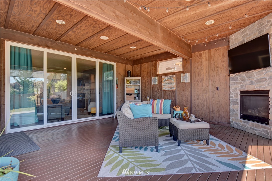 4835 Rosa Court Lacey, WA 98503 - Photo 33 of 40 a outdoor space with patio the couches and a fireplace