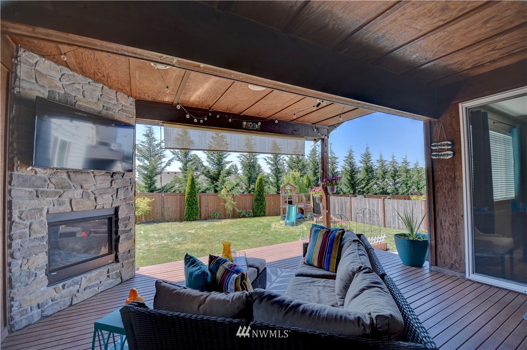 4835 Rosa Court Lacey, WA 98503 - Photo 34 of 40 a view of an outdoor dining space with a table and chairs