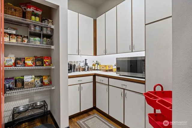a kitchen with stainless steel appliances granite countertop a sink and cabinets