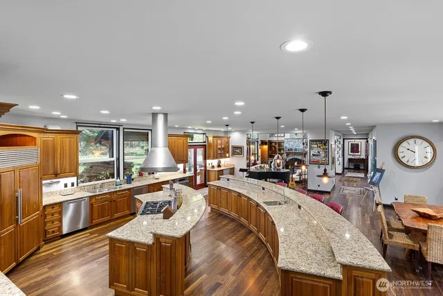 a living room with lots of furniture and kitchen view