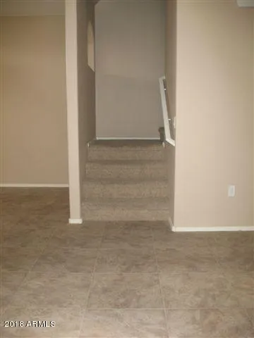 a view of staircase with white walls