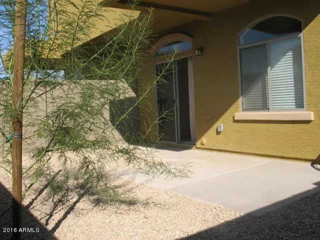 a view of a backyard of the house