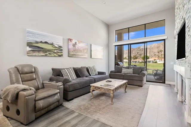 a kitchen with stainless steel appliances a stove a refrigerator and a refrigerator