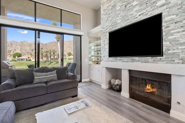 a kitchen with granite countertop a refrigerator and a sink
