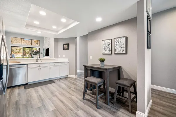 a living room with furniture and a painting