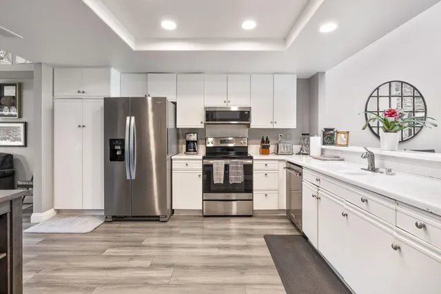 a view of a livingroom with workspace and a couch
