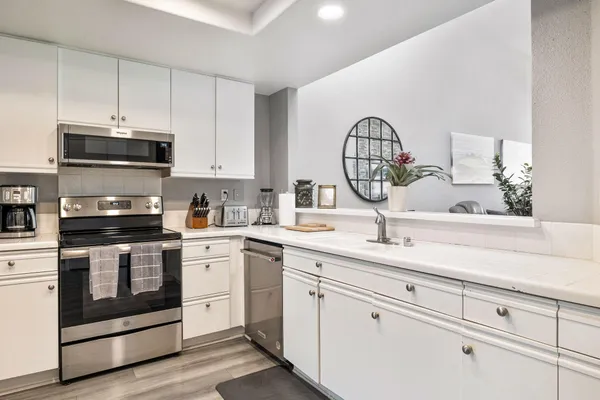 a spacious bedroom with a bed and a window