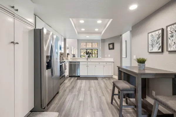 a large bed sitting in a bedroom next to a window