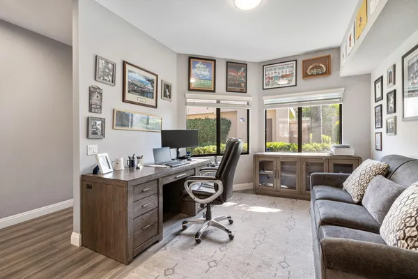 a spacious bathroom with a sink a mirror and shower