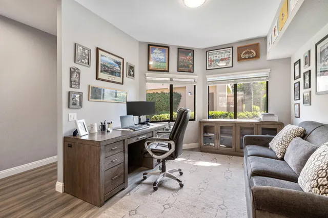 a spacious bathroom with a sink a mirror and shower