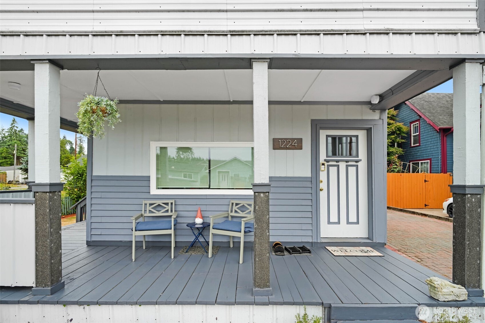 a balcony view with a seating space