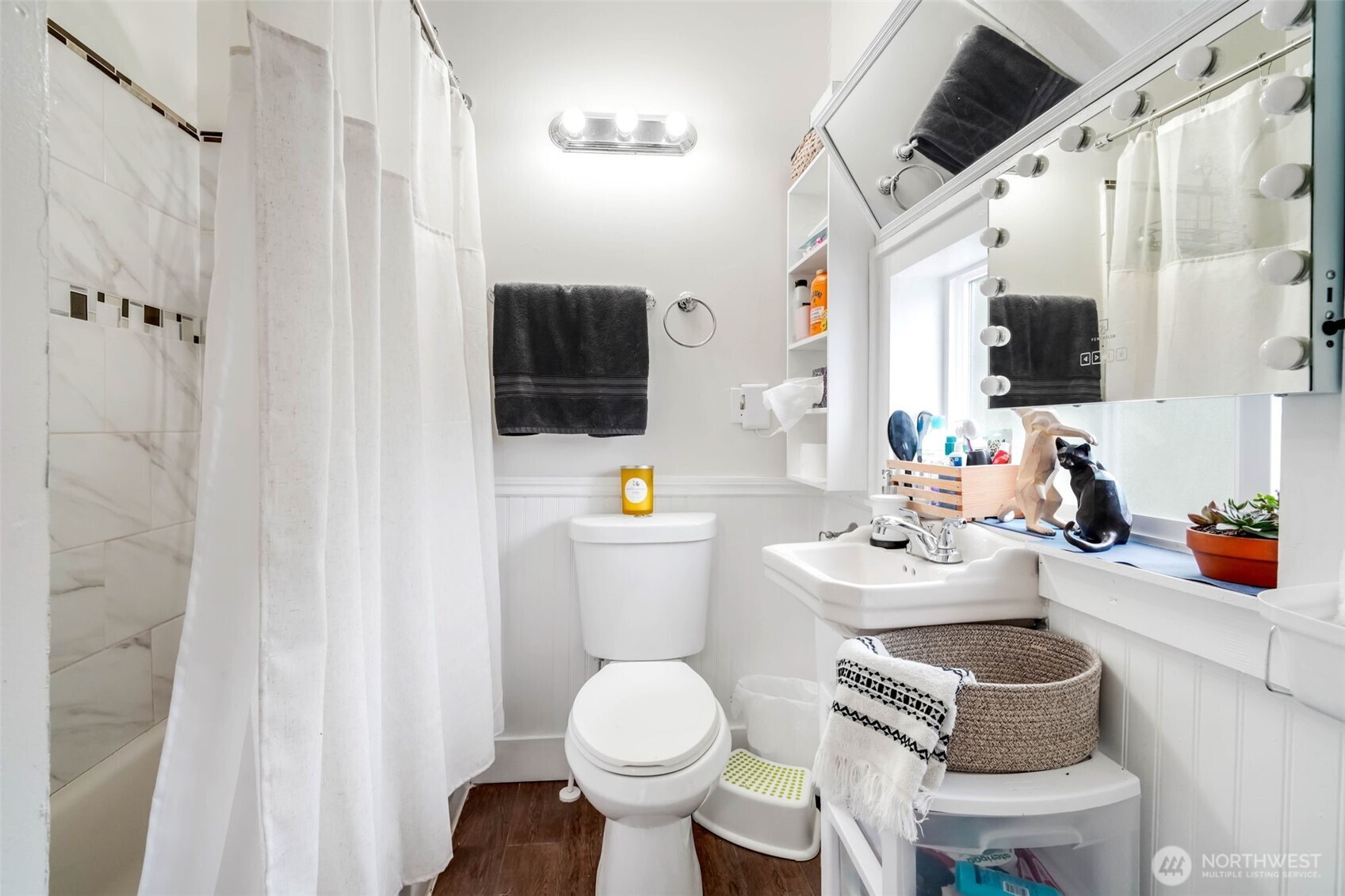 1224 4th Street Cosmopolis, WA 98537 - Photo 11 of 25 a bathroom with a sink toilet a mirror and shower