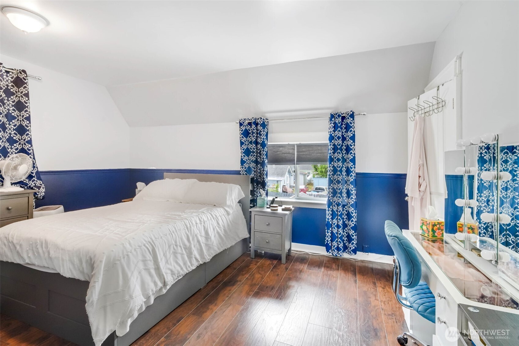 1224 4th Street Cosmopolis, WA 98537 - Photo 16 of 25 a bedroom with a bed and a bookshelf