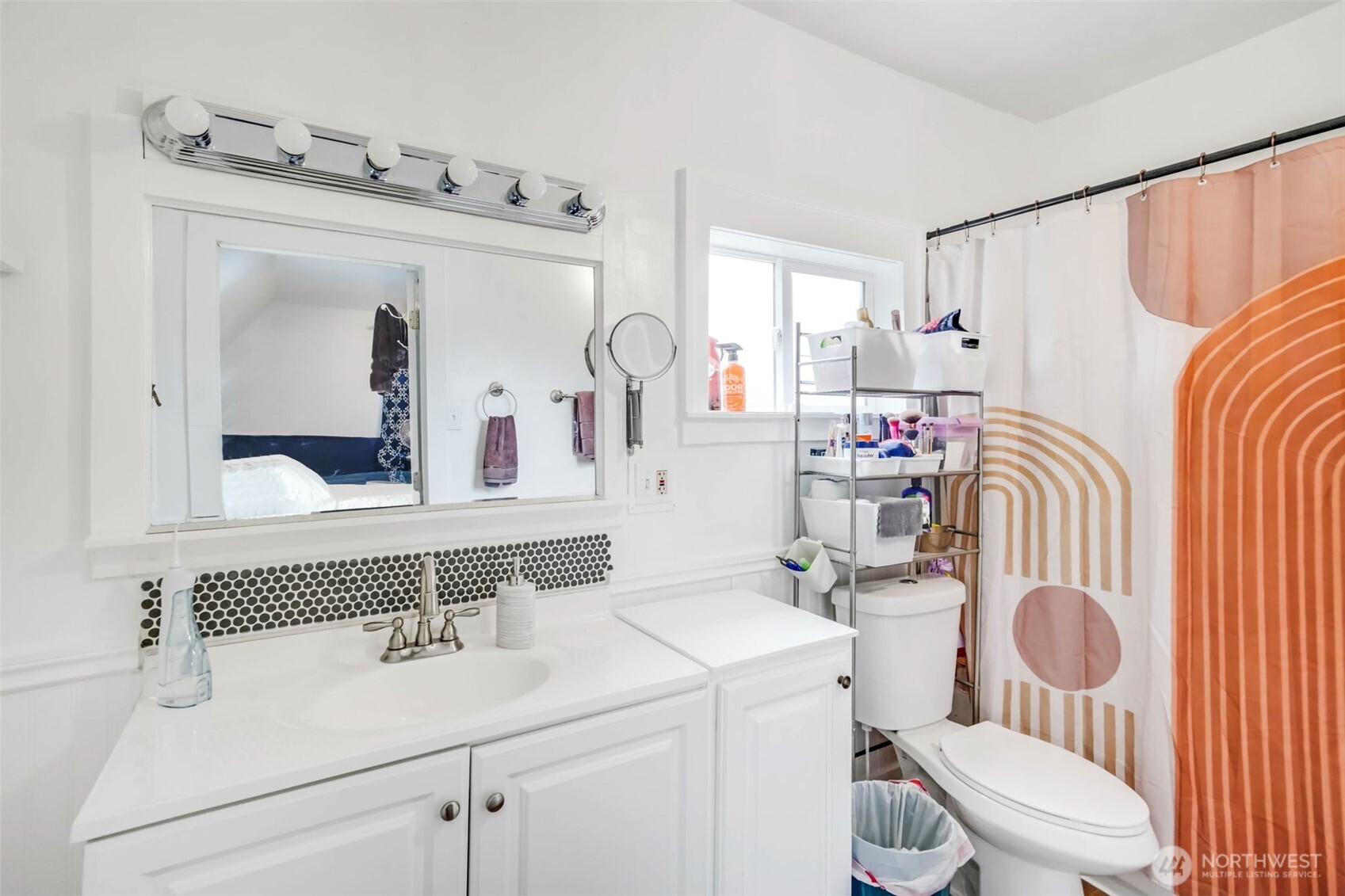 1224 4th Street Cosmopolis, WA 98537 - Photo 17 of 25 a bathroom with a sink a toilet and a mirror