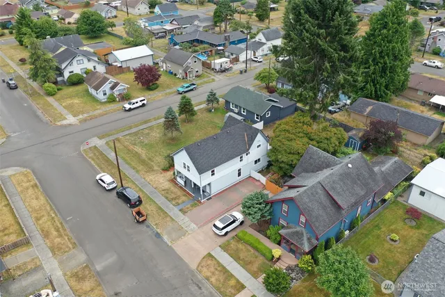 an aerial view of residential house with parking