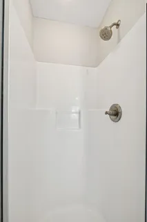 a close view of a shower in the bathroom