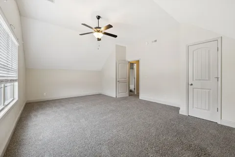 a view of a room with a fan