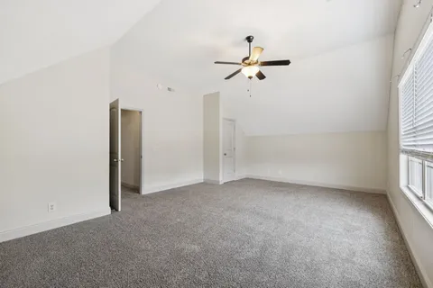 a view of empty room with windows