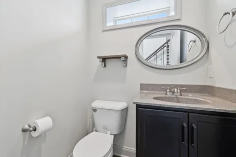 a bathroom with a toilet and a sink