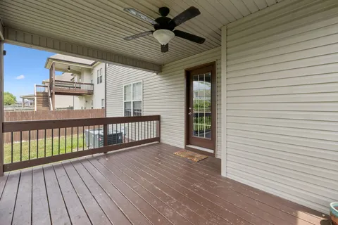a view of a balcony with wooden floor