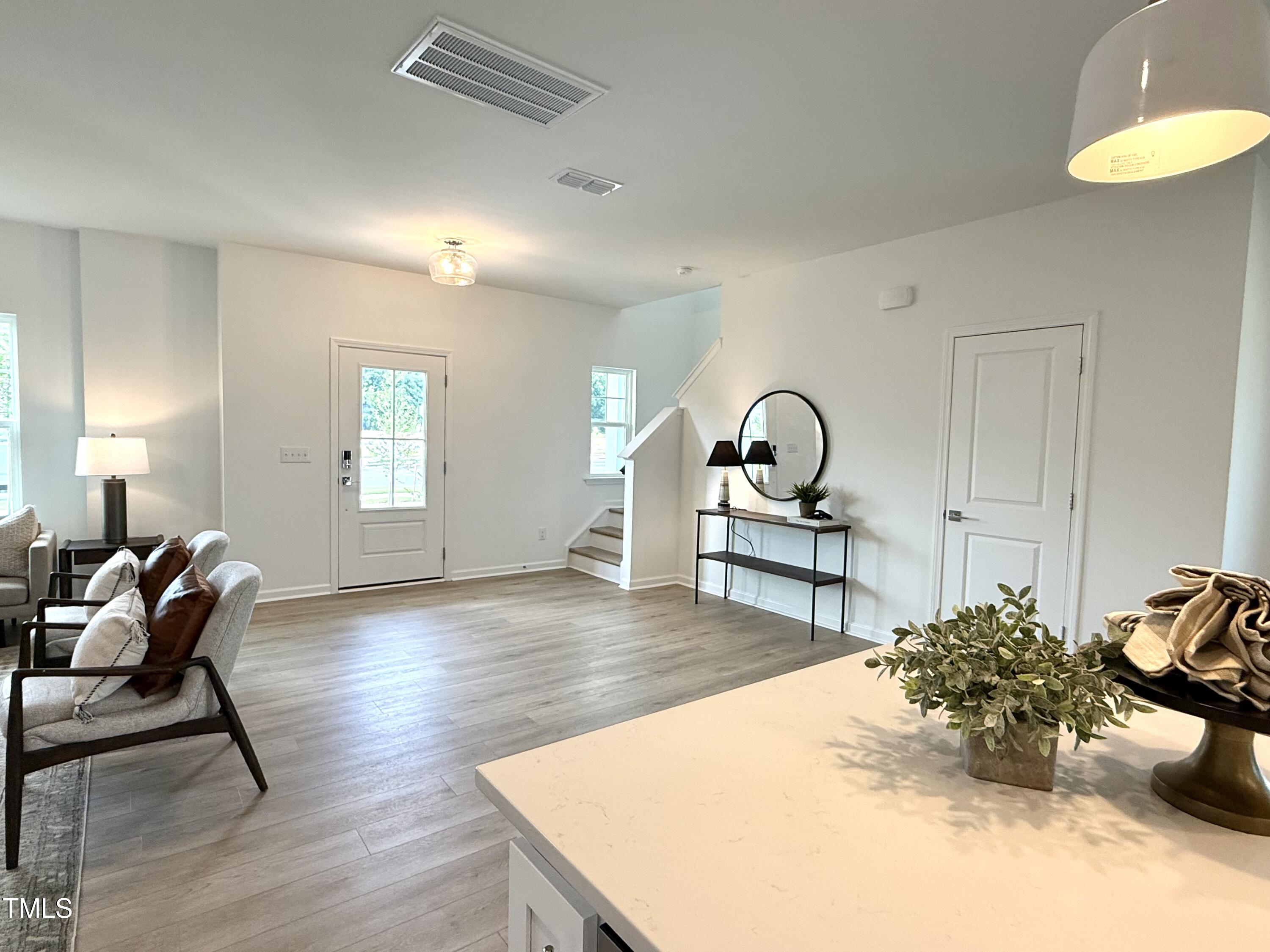 2880 Quarry Road, Unit 163 Rolesville, NC 27571 - Photo 14 of 60 Staged! The stairs are tucked behind the door, not staring at you when you open it!
