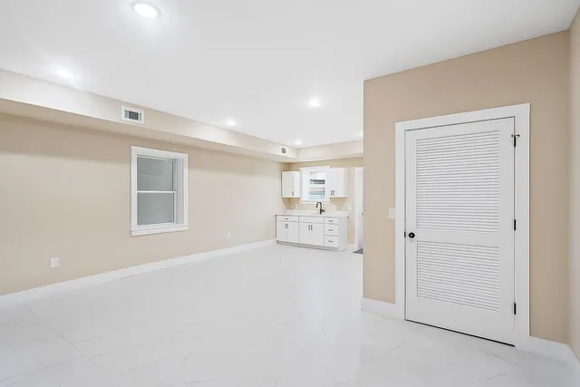 a big room with closet and a bathroom