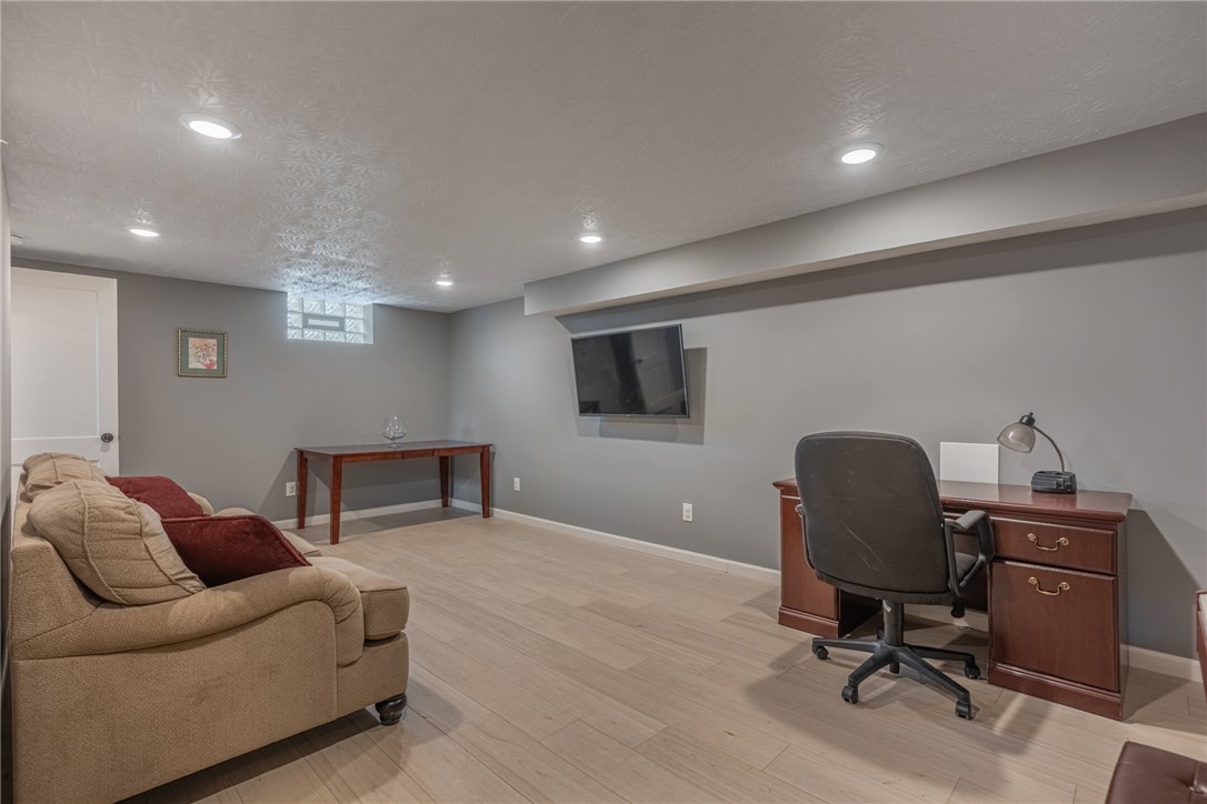 436 Marjorie Avenue Riverside, OH 45404 - Photo 19 of 34 This versatile basement space offers comfortable lounging and a dedicated work area with elegant flooring.