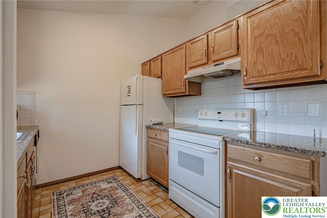 25 North 8th Street Emmaus, PA 18049 - Photo 28 of 51 Functional kitchen with ample cabinetry and essential appliances.