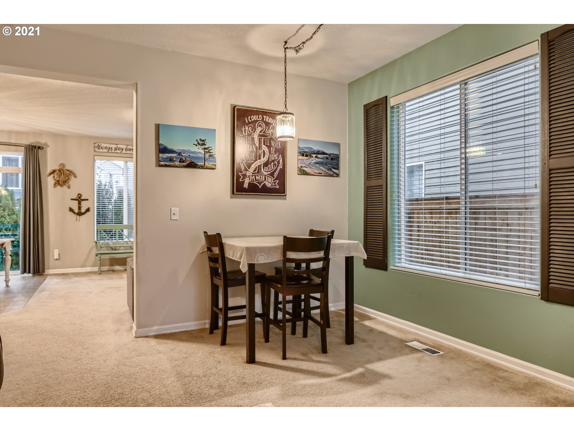 17115 Northeast 13th Place Ridgefield, WA 98642 - Photo 5 of 27 a view of a dining room with furniture and window