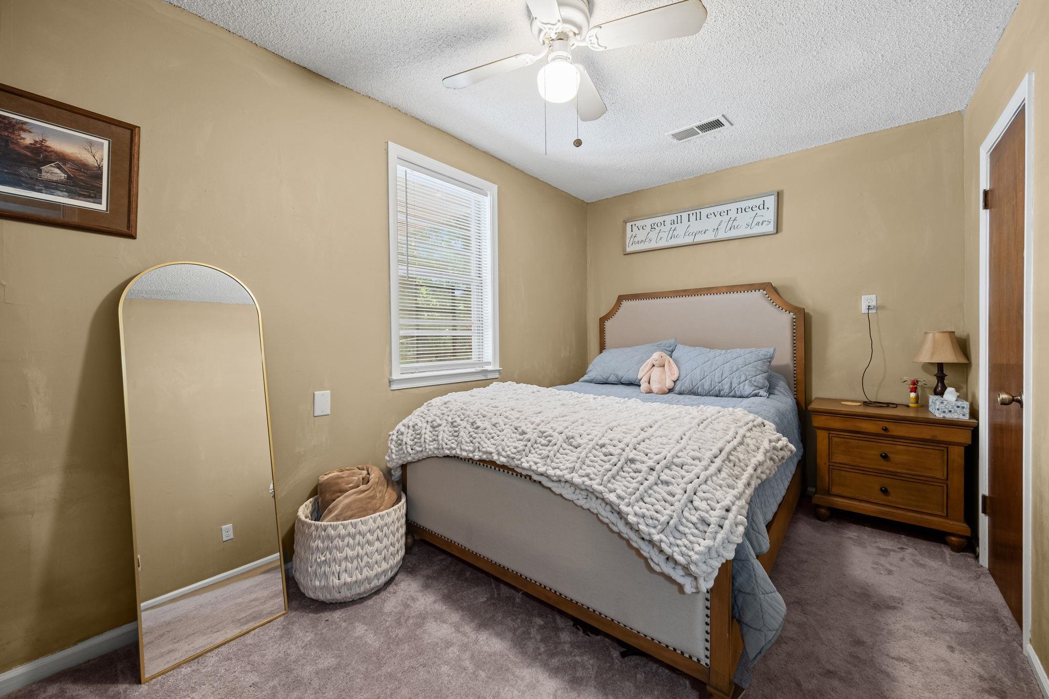 4140 Pleasant Ridge Road Millington, TN 38053 - Photo 15 of 30 Carpeted bedroom featuring a textured ceiling and ceiling fan