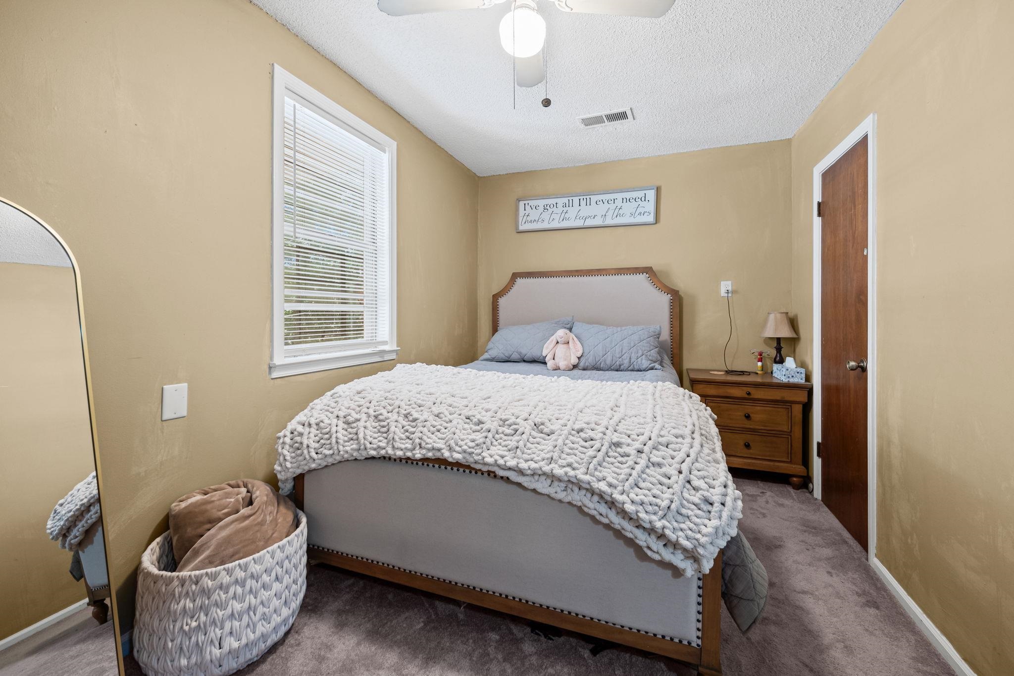 4140 Pleasant Ridge Road Millington, TN 38053 - Photo 16 of 30 Carpeted bedroom featuring a textured ceiling and ceiling fan
