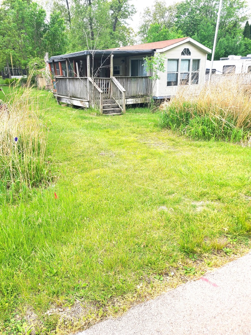 4-213 Woodhaven Sublette, IL 61367 - Photo 3 of 12 a view of a house with backyard and sitting area