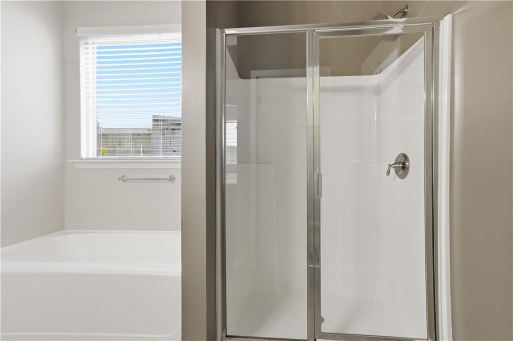 236 Manous Way Canton, GA 30115 - Photo 20 of 25 a bathroom with a shower and a bath tub