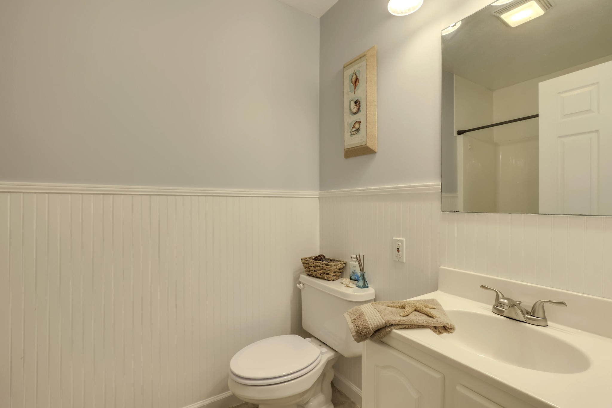 7604 Ogg Road Knoxville, TN 37938 - Photo 13 of 39 a white toilet sitting next to a bathroom sink