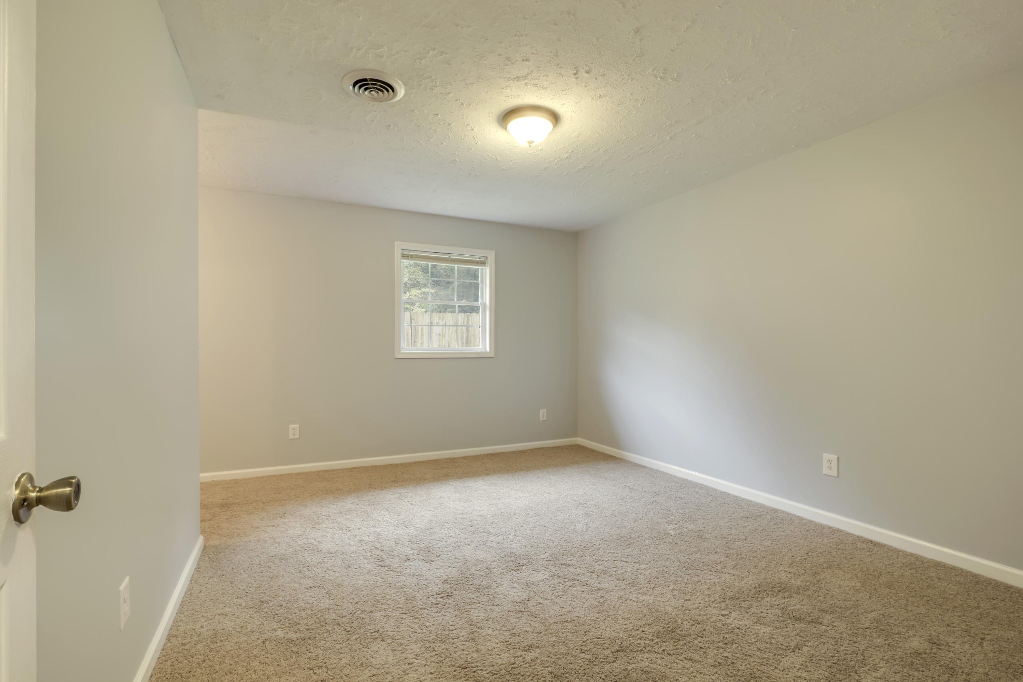 7604 Ogg Road Knoxville, TN 37938 - Photo 14 of 39 a view of an empty room with a window