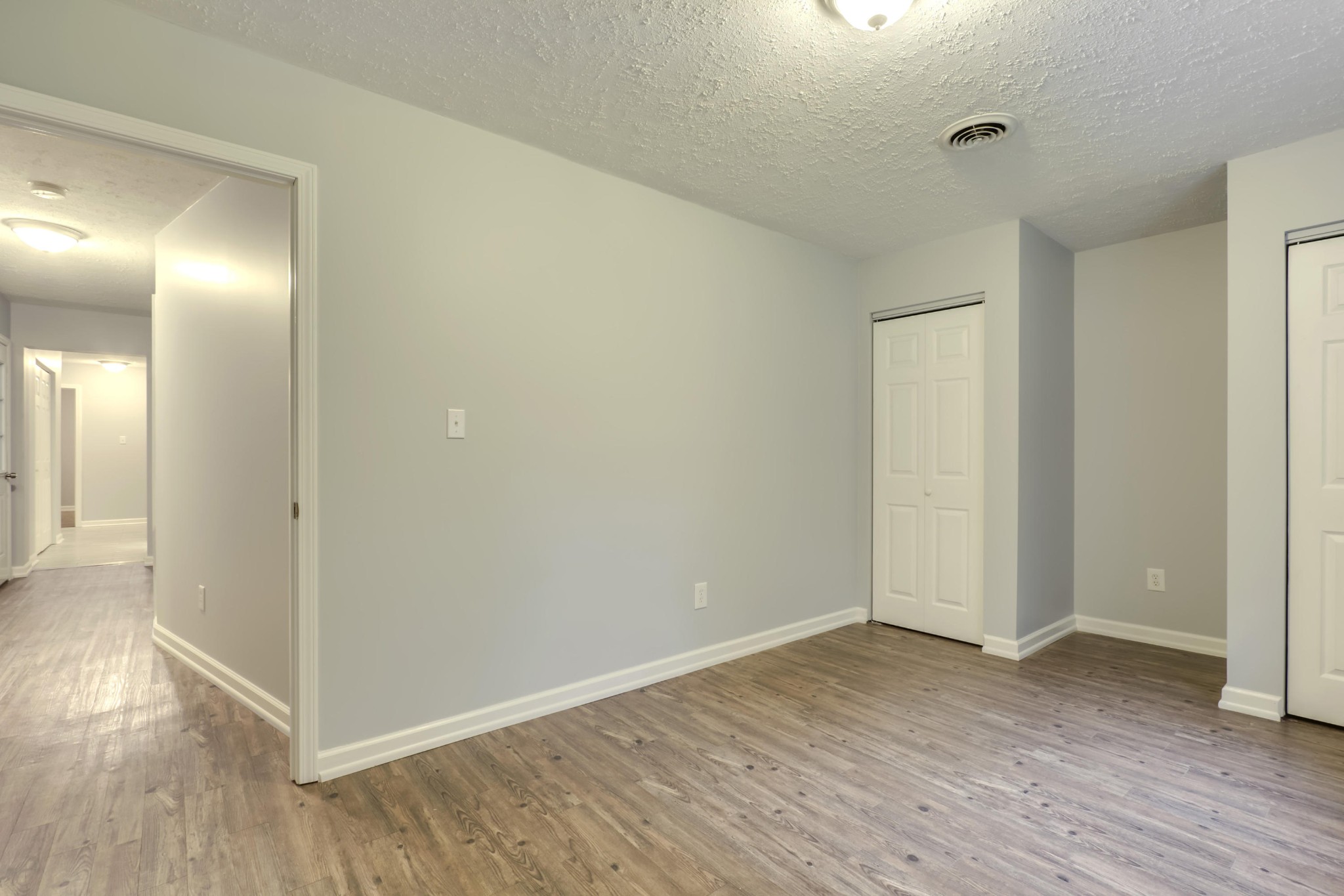 7604 Ogg Road Knoxville, TN 37938 - Photo 19 of 39 a view of an empty room with wooden floor