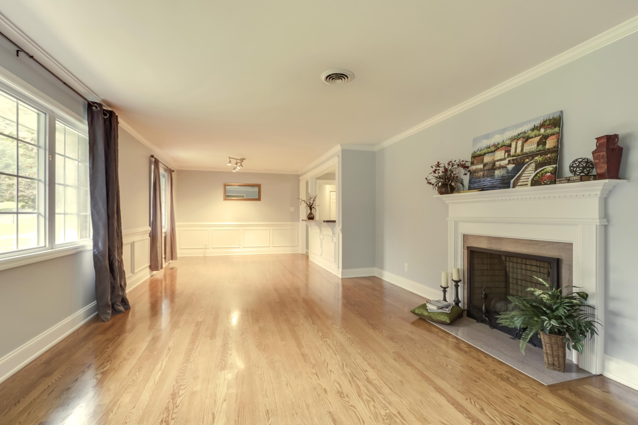 7604 Ogg Road Knoxville, TN 37938 - Photo 2 of 39 a view of empty room with wooden floor and fireplace
