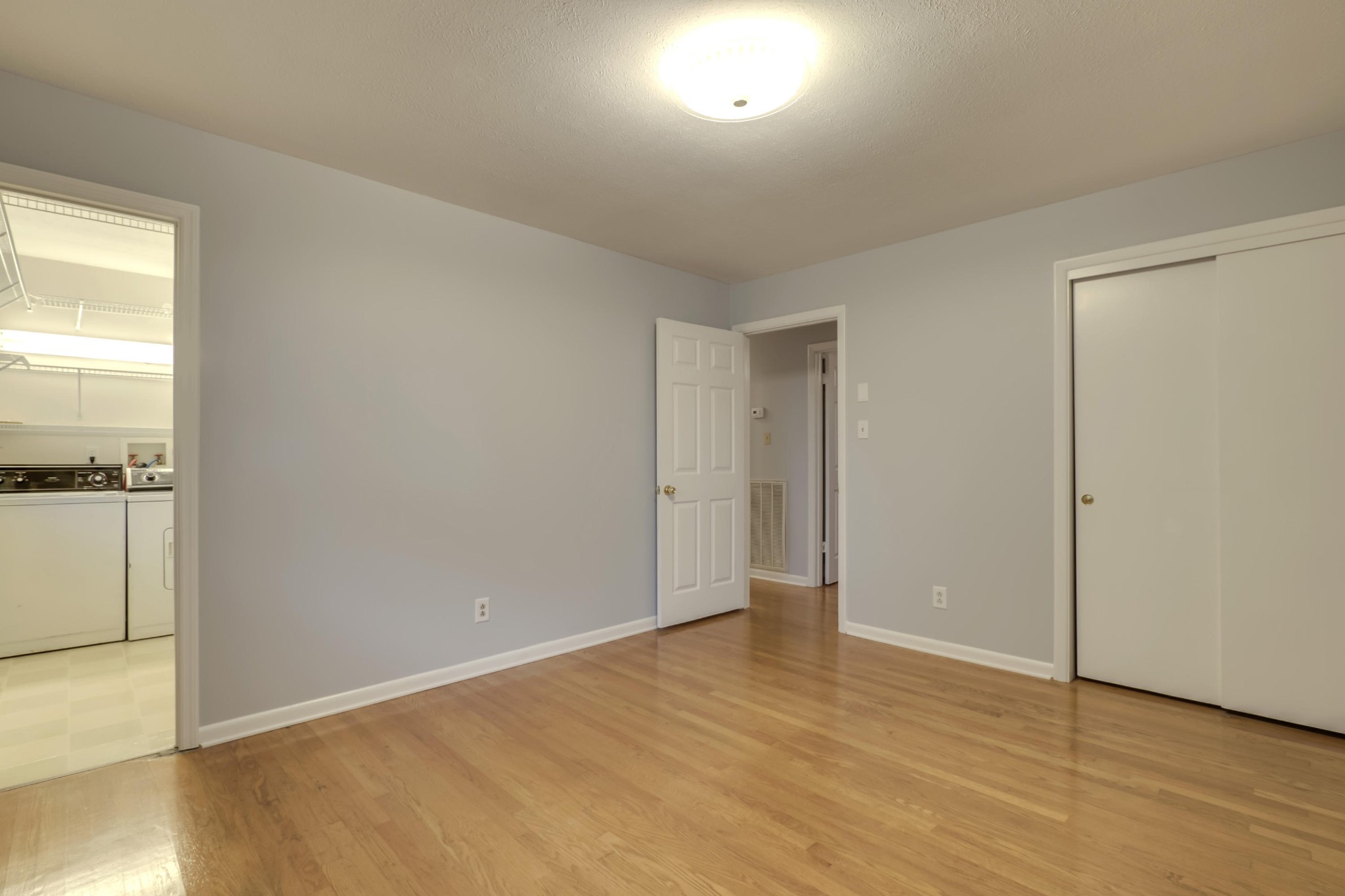 7604 Ogg Road Knoxville, TN 37938 - Photo 29 of 39 an empty room with wooden floor and windows