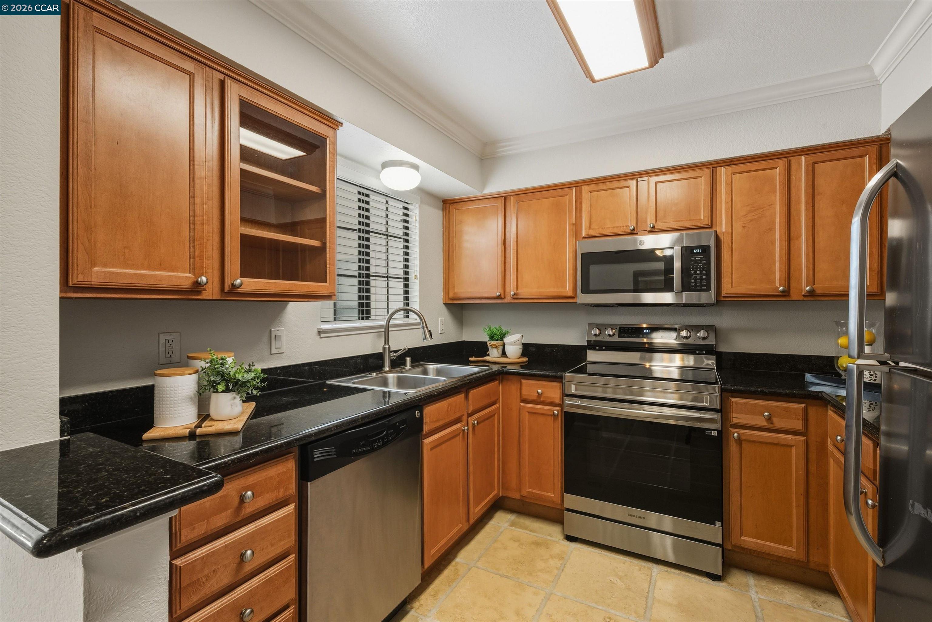 332 Eastridge Drive San Ramon, CA 94582 - Photo 17 of 41 a kitchen with stainless steel appliances granite countertop a sink stove and microwave