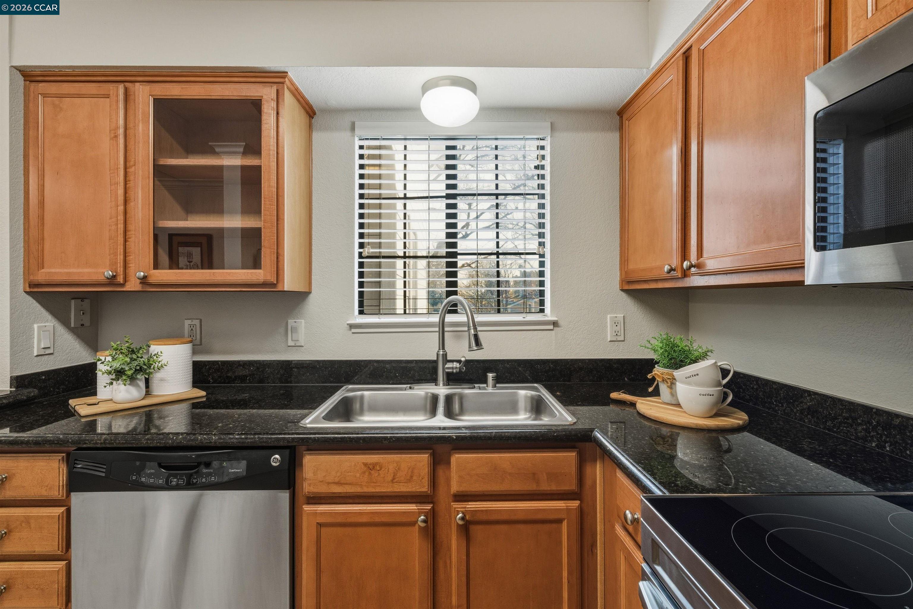 332 Eastridge Drive San Ramon, CA 94582 - Photo 19 of 41 a kitchen with stainless steel appliances granite countertop a sink and cabinets