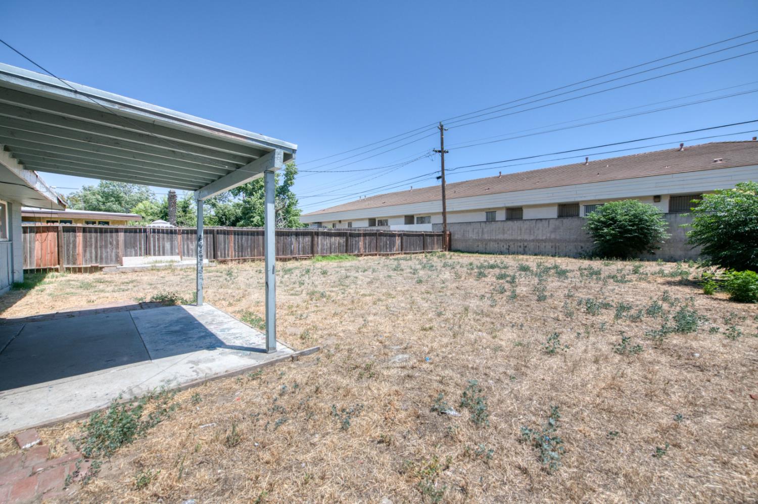 2326 East Hampton Way Fresno, CA 93726 - Photo 18 of 22 a view of a backyard