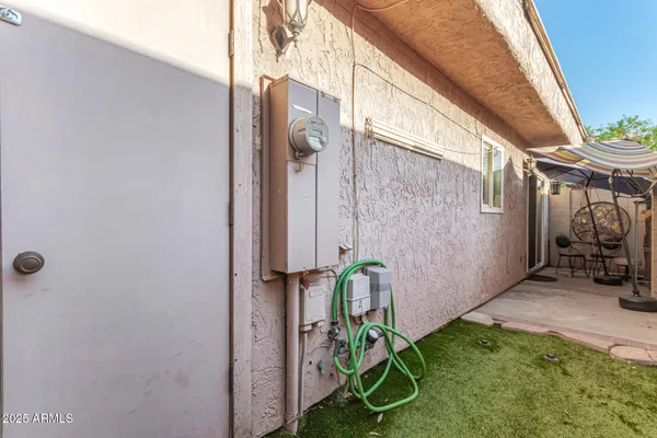 a backyard with hardwood wall and shower