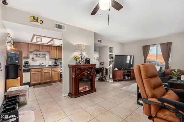a kitchen with stainless steel appliances kitchen island granite countertop a sink and cabinets