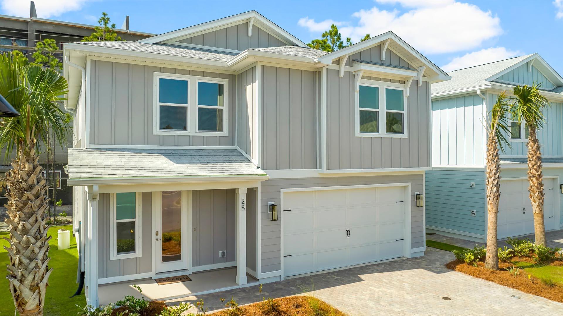 25 Ashwood Drive Santa Rosa Beach, FL 32459 - Photo 1 of 54 a view of a white house with large windows and plants